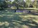 Large backyard with lush landscaping and a patio area at 1520 Moravia Ave, Holly Hill, FL 32117