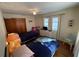 Bedroom with twin beds and white dresser at 1520 Moravia Ave, Holly Hill, FL 32117