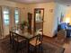 Dining room with glass-top table and view of kitchen at 1520 Moravia Ave, Holly Hill, FL 32117