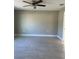 Well-lit bedroom with ceiling fan, neutral paint, base trim, and neutral flooring at 1621 Pear Ave, Sanford, FL 32771