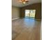 Spacious bedroom with neutral paint, ceiling fan, and sliding glass doors leading to outdoor patio at 1621 Pear Ave, Sanford, FL 32771