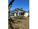 Newly constructed single-story home featuring neutral color palette and attached one-car garage on a sunny day at 1621 Pear Ave, Sanford, FL 32771
