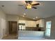 Living room featuring neutral paint, ceiling fan, and connecting to the kitchen at 1621 Pear Ave, Sanford, FL 32771