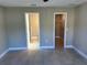Bedroom featuring doorways leading to ensuite bath with stand up shower and walk-in closet at 1621 Pear Ave, Sanford, FL 32771