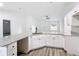 Modern kitchen with white cabinets, granite countertops and island at 22474 Sw Rainbow Lakes Blvd, Dunnellon, FL 34431