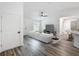 Open concept living room with hardwood floors and staged furniture at 22474 Sw Rainbow Lakes Blvd, Dunnellon, FL 34431