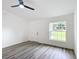 Spacious living room featuring vinyl plank flooring and a window at 22474 Sw Rainbow Lakes Blvd, Dunnellon, FL 34431