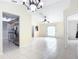 Spacious living room with tile floors and a view into the kitchen at 2360 Newmark Dr, Deltona, FL 32738