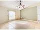 Spacious living room with tile floors and a ceiling fan at 2360 Newmark Dr, Deltona, FL 32738