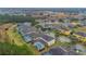 Aerial view of neighborhood with houses and pools at 256 Yellow Snapdragon Dr, Davenport, FL 33837