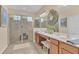 Double vanity bathroom with a large walk-in shower at 256 Yellow Snapdragon Dr, Davenport, FL 33837