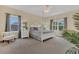 Bright bedroom featuring a comfortable bed and large windows at 256 Yellow Snapdragon Dr, Davenport, FL 33837
