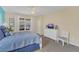 Spacious bedroom with a dresser and large window at 256 Yellow Snapdragon Dr, Davenport, FL 33837