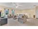 Spacious bonus room with couches and a coffee table at 256 Yellow Snapdragon Dr, Davenport, FL 33837