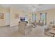 Bonus room with couches, coffee table, and large windows at 256 Yellow Snapdragon Dr, Davenport, FL 33837