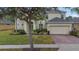 Two-story house with brick driveway and landscaping at 256 Yellow Snapdragon Dr, Davenport, FL 33837