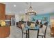 Open concept kitchen with stainless steel appliances and breakfast nook at 256 Yellow Snapdragon Dr, Davenport, FL 33837