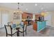 Modern kitchen with dark wood cabinets and a breakfast bar at 256 Yellow Snapdragon Dr, Davenport, FL 33837