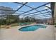 Inviting pool area with screened enclosure, spa, and lounge chairs at 256 Yellow Snapdragon Dr, Davenport, FL 33837