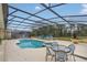 Inviting pool area with covered patio and seating at 256 Yellow Snapdragon Dr, Davenport, FL 33837