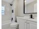 Modern bathroom with white vanity, marble shower, and black fixtures at 805 Willow Ave, Sanford, FL 32771