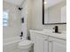 Updated bathroom with marble tile, white vanity, and modern fixtures at 805 Willow Ave, Sanford, FL 32771