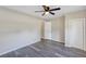 Bright bedroom with ceiling fan and grey vinyl plank flooring at 805 Willow Ave, Sanford, FL 32771