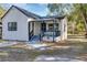 Charming white house with gray accents and a covered porch at 805 Willow Ave, Sanford, FL 32771