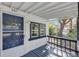 Front porch with blue door and view of the yard at 805 Willow Ave, Sanford, FL 32771
