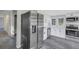Modern kitchen with stainless steel appliances and white cabinets at 805 Willow Ave, Sanford, FL 32771