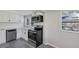 Modern kitchen with stainless steel appliances and white cabinets at 805 Willow Ave, Sanford, FL 32771