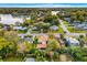 Aerial view showing a house's location in a neighborhood near a lake at 811 Briercliff Dr, Orlando, FL 32806