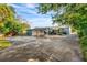 Large backyard with covered carport and side entrance at 811 Briercliff Dr, Orlando, FL 32806
