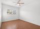 Bright bedroom with wood-look floors and a ceiling fan at 811 Briercliff Dr, Orlando, FL 32806