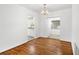 Hardwood floor dining room with chandelier and view of kitchen at 811 Briercliff Dr, Orlando, FL 32806