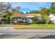 House exterior showcasing a light green house with a well-maintained lawn at 811 Briercliff Dr, Orlando, FL 32806