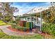 Charming light green house with landscaped yard and walkway at 811 Briercliff Dr, Orlando, FL 32806