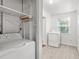 Bright laundry room with washer, dryer, and extra shelving at 811 Briercliff Dr, Orlando, FL 32806
