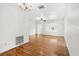 Spacious living room with hardwood floors and a large window at 811 Briercliff Dr, Orlando, FL 32806