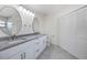 Bathroom with double sinks, granite countertop, modern vanity and marble tile flooring at 10632 Whitestone Ct, Orlando, FL 32817