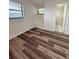 A cozy bedroom features new hardwood floors, fresh paint and a bright ensuite at 10632 Whitestone Ct, Orlando, FL 32817