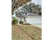 Beautiful home features an attached two-car garage, green lawn, and lovely landscaping at 10632 Whitestone Ct, Orlando, FL 32817