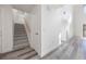 Hallway with high ceilings, staircase, and modern flooring at 10632 Whitestone Ct, Orlando, FL 32817