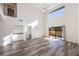 Bright, open living room with vaulted ceilings, wood-look flooring, and a sliding glass door at 10632 Whitestone Ct, Orlando, FL 32817