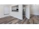 Open living area with a view of the kitchen and white cabinets at 10632 Whitestone Ct, Orlando, FL 32817