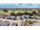 Aerial view of neighborhood with homes, street, and playground at 11237 Amber Ridge Dr, Zellwood, FL 32798