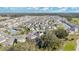 Aerial view of a large community with houses, pool, and playground at 11237 Amber Ridge Dr, Zellwood, FL 32798