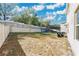 Backyard view showing a grassy area, fence, and a trampoline at 11237 Amber Ridge Dr, Zellwood, FL 32798
