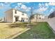 Large backyard with a trampoline and partial view of the house at 11237 Amber Ridge Dr, Zellwood, FL 32798