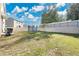 Spacious backyard with trampoline, privacy fence, and grassy area at 11237 Amber Ridge Dr, Zellwood, FL 32798